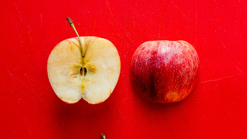 An apple cut in half inside and outer image.