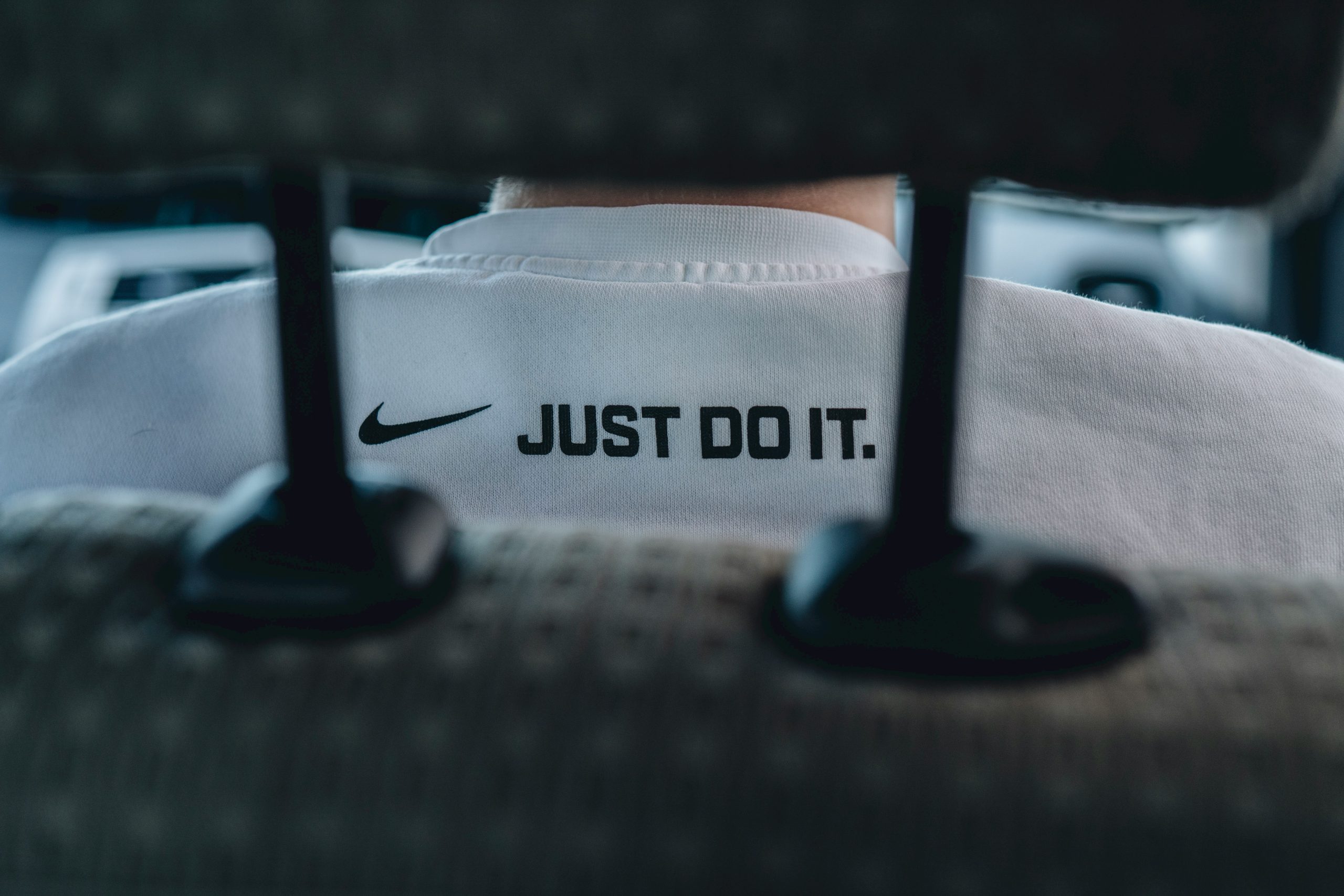 Nike logo with slogan in a shirt.