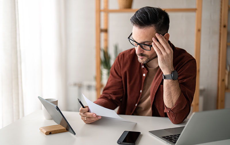 Businessman in home office concentrated on branding issues with his business
