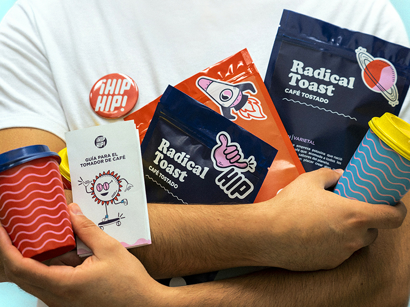 Packaging designer holding packaging examples