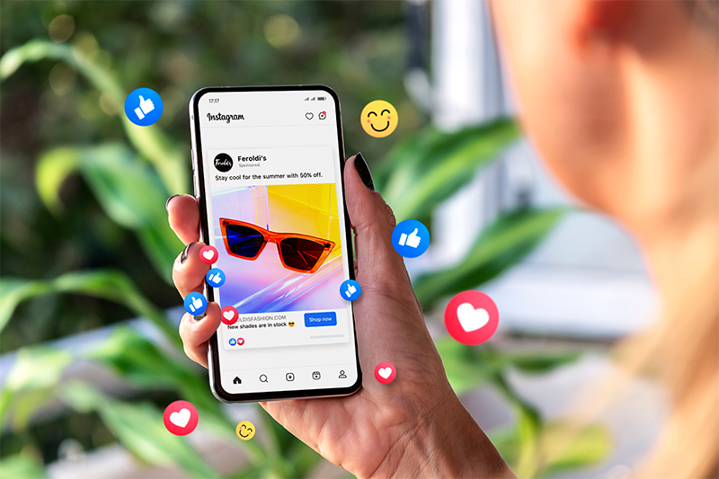 Meta ads on mobile phone screen illustrating examples of marketing and branding